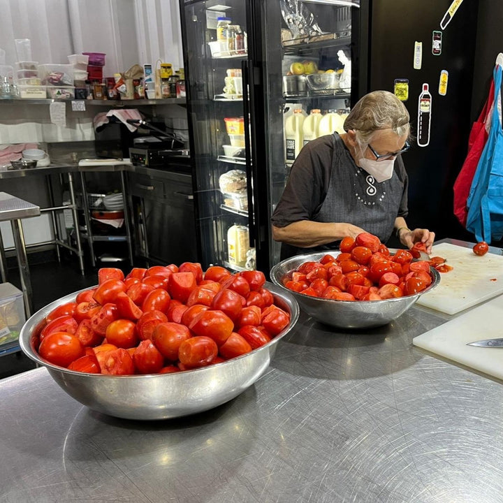 bowls of organic tomatoes being made into passata in melbourne