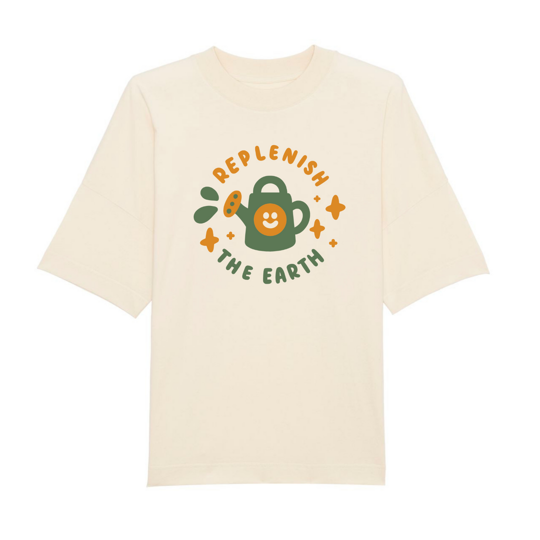 oversized cream organic cotton shirt with cute orange and green design of smiling watering can saying replenish the earth